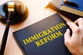 Immigration reform and gavel on a desk. Royalty Free Stock Photo