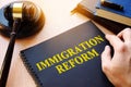 Immigration reform and gavel on a desk.