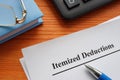 Documents about Itemized deductions on the wooden surface. Royalty Free Stock Photo