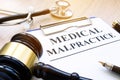 Documents about medical malpractice and gavel. Royalty Free Stock Photo