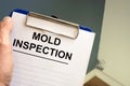 Documents about mold inspection with clipboard Royalty Free Stock Photo