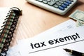 Documents with title tax exempt on a table