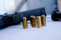 A handgun with bullets symbolizing gun rights while framed against the United States constitution. Royalty Free Stock Photo