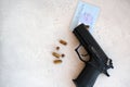 A handgun with bullets symbolizing gun rights while framed against the United States constitution. Royalty Free Stock Photo