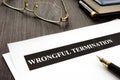 Documents about Wrongful termination on a desk