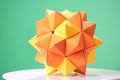 Dodecahedron origami on green background