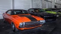 Three Dodge Challenger cars, including an RT with a 426 Hemi