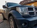 Dodge Nitro side view, focus on the headlight. Royalty Free Stock Photo