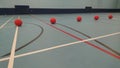 5 dodgeballs lined up in a row