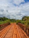 Dodgy Wooden Bridge With Timber Planks And Old Iron Rails Crossing River In Gabon, Central Africa