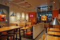 Dodo Pizza is a modern pizza brand franchise. Fast food dining place interior branded in orange colors