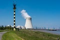 Doel, East - Flanders - Belgium - Landscape view over the dike of the village with the nuclear cooling towers in the background Royalty Free Stock Photo