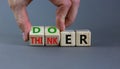 Doer or thinker symbol. Concept words Doer or thinker on wooden cubes. Businessman hand. Beautiful grey table grey background.