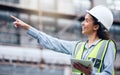 She always does her job thoroughly. a young female architect using a digital tablet at a building site. Royalty Free Stock Photo