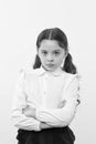 She does not agree with you. Girl serious face offended yellow background. Kid unhappy looks strictly. Girl school Royalty Free Stock Photo