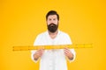 Does size really matter. Man bearded hipster holding ruler. Measure length. Size tall and length. Big size. Measure and