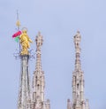 Square detail of the golden madonna above the Duomo di Milano.