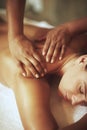 It doesnt get anymore relaxing.... Shot of a young woman enjoying a back massage. Royalty Free Stock Photo