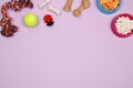 Dog accessories, food and toy on purple background. Flat lay. To Royalty Free Stock Photo