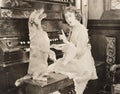 Dog accompanying woman on piano