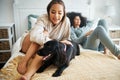 Dog, bed and gay couple play in home, morning and relax together in house. Pet, bedroom and lesbian women with animal Royalty Free Stock Photo