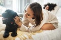 Dog, bed and happy lesbian couple play in home, morning and relax together in house. Pet, bedroom and gay women with Royalty Free Stock Photo