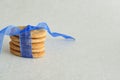 Dog biscuits with a blue ribbon Royalty Free Stock Photo