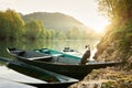 dog in a boat at sunrise. Beautiful pet on a morning walk. Adventure, Royalty Free Stock Photo