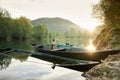 dog in a boat at sunrise. Beautiful pet on a morning walk. Adventure, Royalty Free Stock Photo