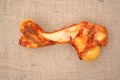 Dog bone on a sizal sack. Royalty Free Stock Photo