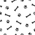 Dog or cat paw and bone seamless pattern. Animals paw print