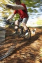 Dog Chasing Man On Mountain Bike Royalty Free Stock Photo