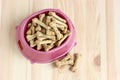 Dog food, cookies in a plastic bowl, top view Royalty Free Stock Photo