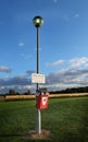 Dog fouling sign and bin. Royalty Free Stock Photo