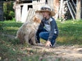 Dog funny kissing a little girl