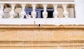 A dog gazes lazily on the veranda of a traditional house in the old city of Nicosia, Cyprus Royalty Free Stock Photo