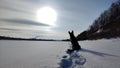 Dog German Shepherd on a big field in a winter day and white snow arround. Waiting eastern European dog veo Royalty Free Stock Photo