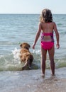 Dog and girl playing fetch Royalty Free Stock Photo