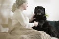 Dog giving paw sick woman Royalty Free Stock Photo