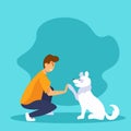 Dog and guy giving a high five. Best friends concept. Happy smiling man and funny white dog playing together. Royalty Free Stock Photo