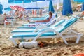 The dog hides in the shade of a lounger on a Turkish beach Royalty Free Stock Photo