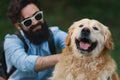 Dog and his owner - Cool dog and young man having fun Royalty Free Stock Photo