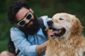 Dog and his owner - Cool dog and young man having fun Royalty Free Stock Photo