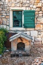 Dog house in front of Mediterranean house Royalty Free Stock Photo