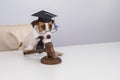 Dog jack russell terrier dressed as a judge and holding a gavel on a white background. Royalty Free Stock Photo