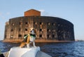 Dog in a life jacket in a boat. beagle puppy sea voyage