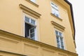 The dog looks out the window of the house at passers-by. Background with selective focus Royalty Free Stock Photo