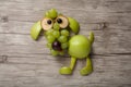 Dog made of apple, grape and banana