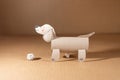 a dog made out of toilet paper roll, cut out of cardboard, dachshund, kids toy, recycled paper craft concept, DIY, Royalty Free Stock Photo