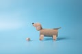 a dog made out of toilet paper roll, cut out of cardboard, dachshund, kids toy, recycled paper craft concept, DIY, Royalty Free Stock Photo